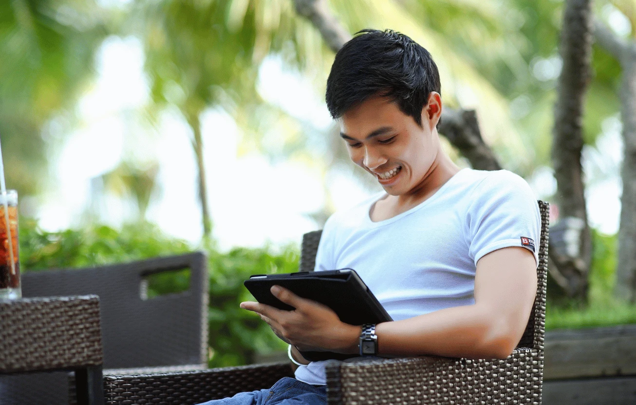 A man checking his data on a tablet.