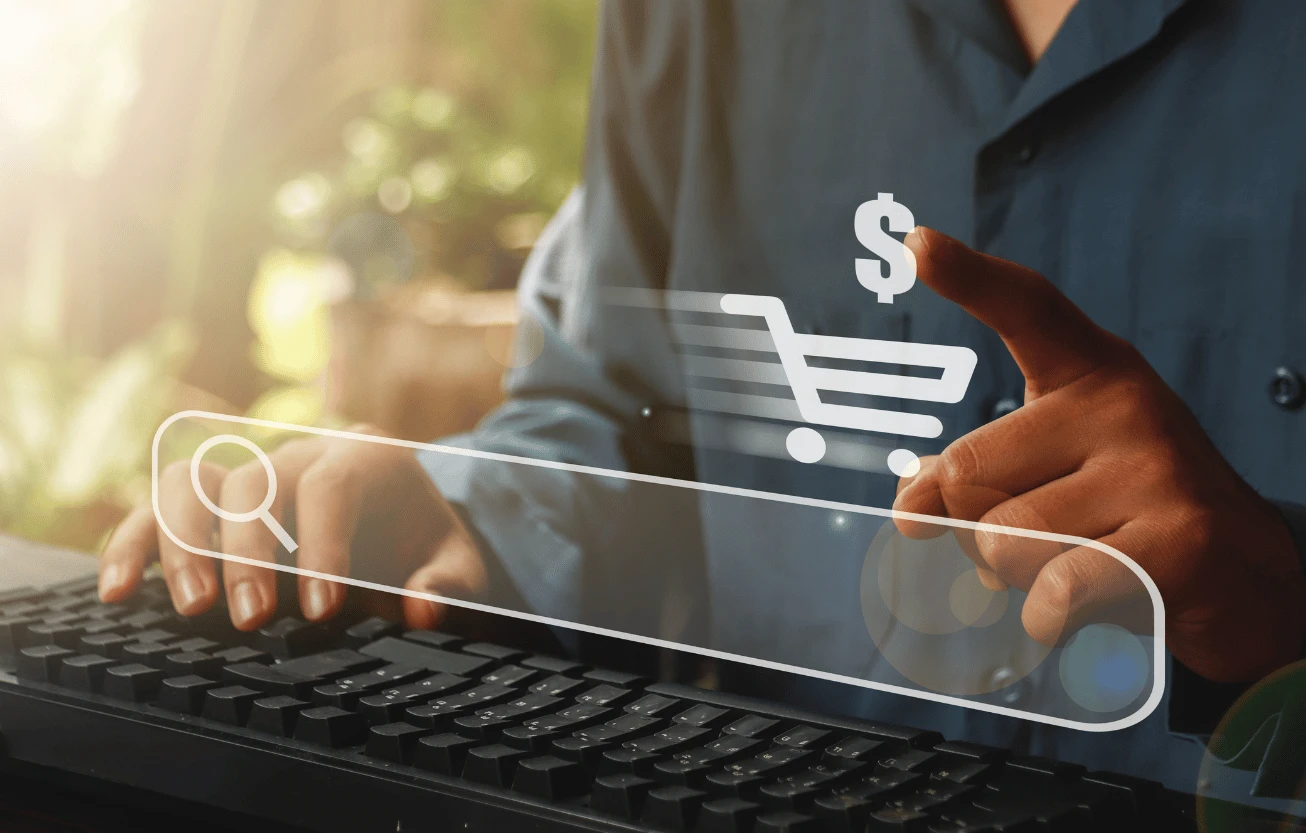 A shopping cart icon hovering over a keyboard.